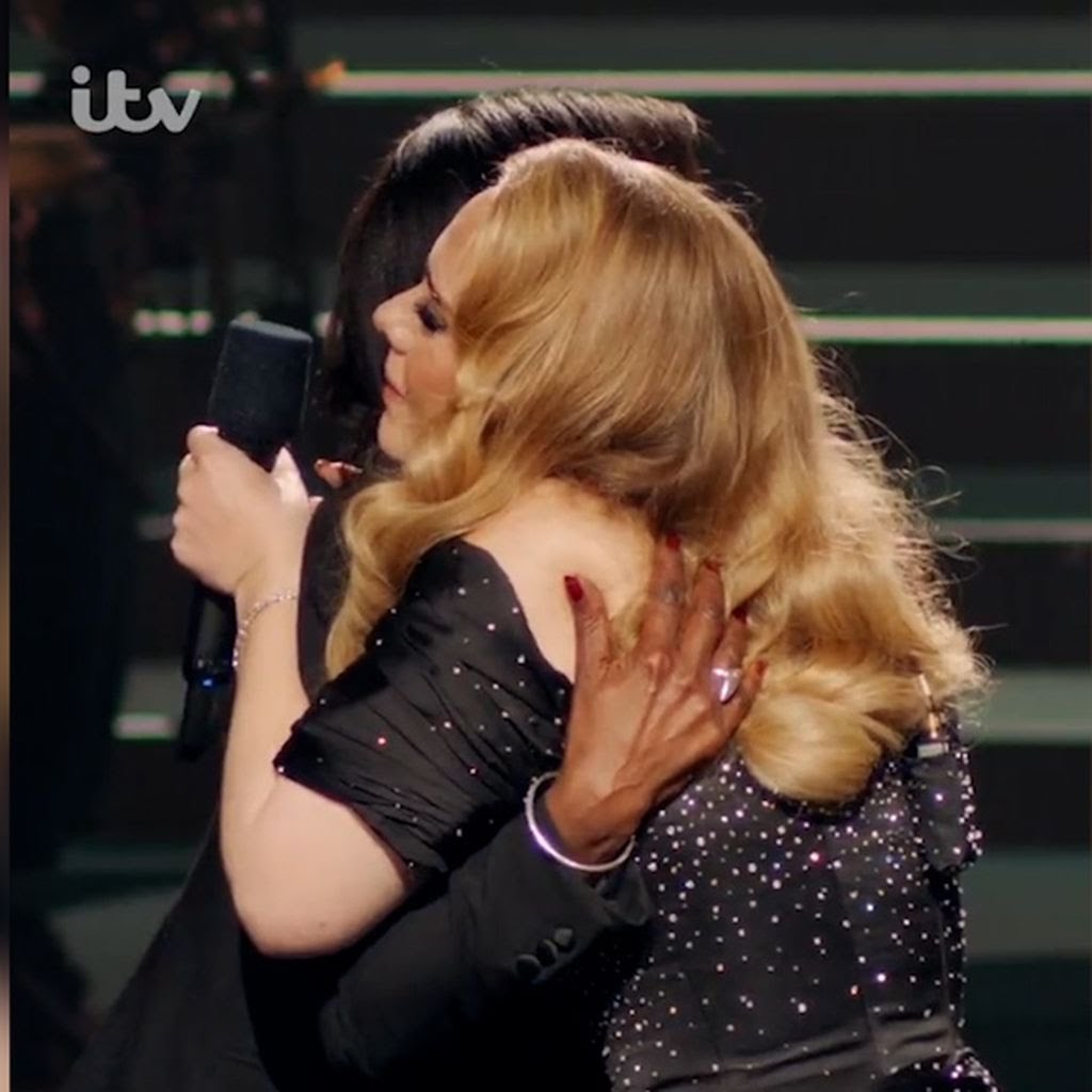 Adele hugging Ms. McDonald