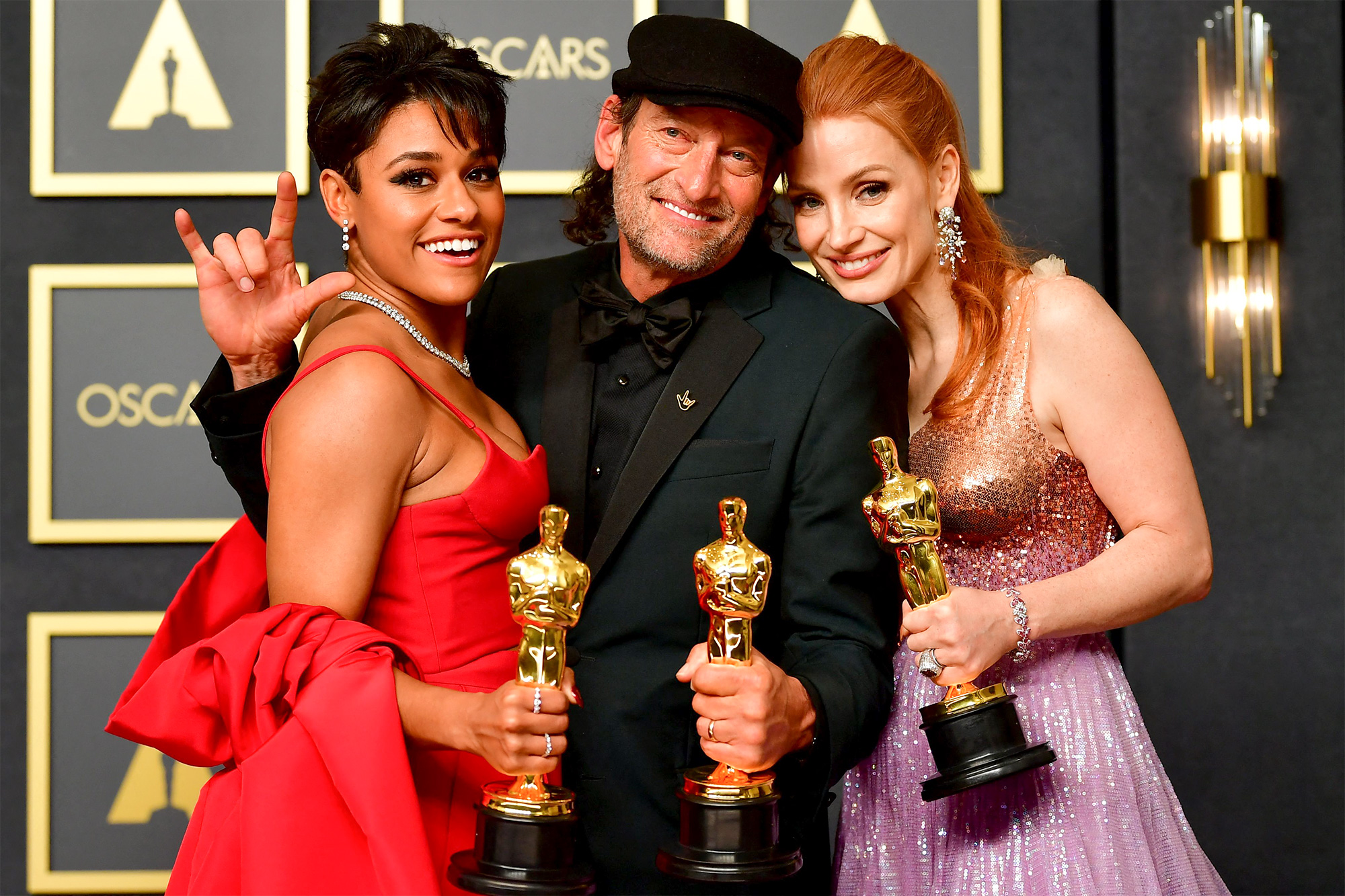 Best Actor in a Supporting Role Troy Kotsur (C), Best Actress in a Supporting Role Ariana DeBose (L) and Best Actress in a Leading Role Jessica Chastain (R) pose together during the 94th Oscars at the Dolby Theatre in Hollywood, California on March 27, 2022. in the press room during the 94th Oscars at the Dolby Theatre in Hollywood, California on March 27, 2022